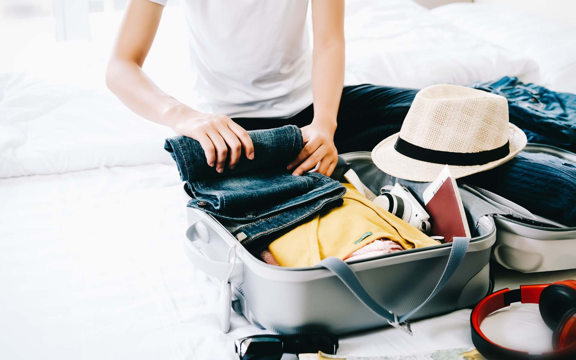 Woman packing a suitcase for a trip