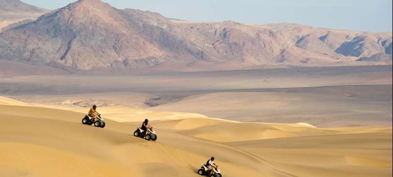 quad biking dunes