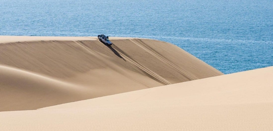  Skeleton Coast | Discover Africa Safaris | vertical descent down massive sand dunes