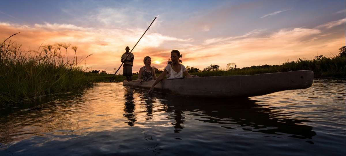 A mokoro ride at sunset on the Khwai River during May, one of the best times to visit Botswana