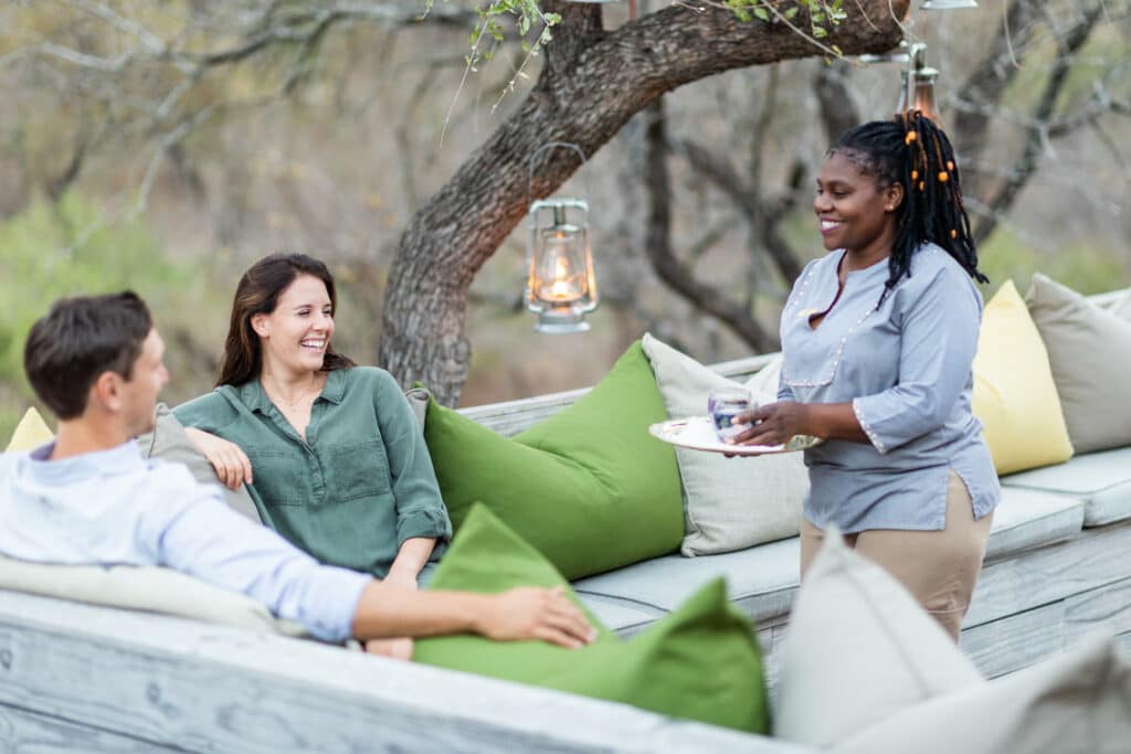 Couple having a gin tasting in Sabi Sand. Photo: Simbambili