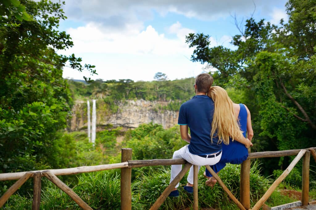 Young couple enjoying perfect view on Chamarel falls of Mauritius