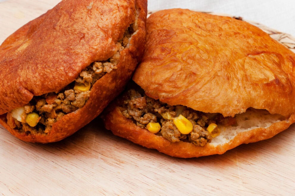 Vetkoeks filled with a ground beef mixture.
