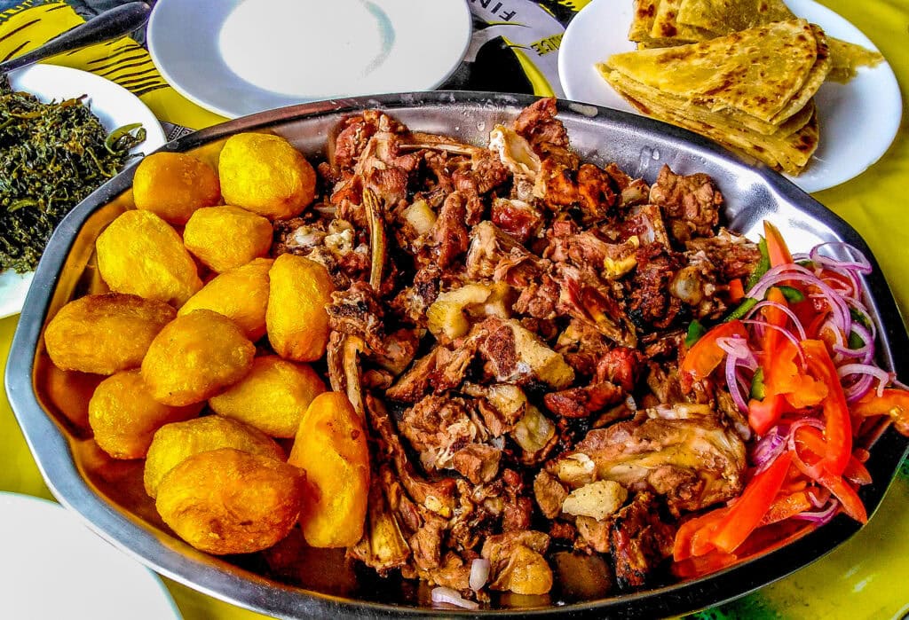 Sharing a traditional platter of Nyama choma. Photo: Istock