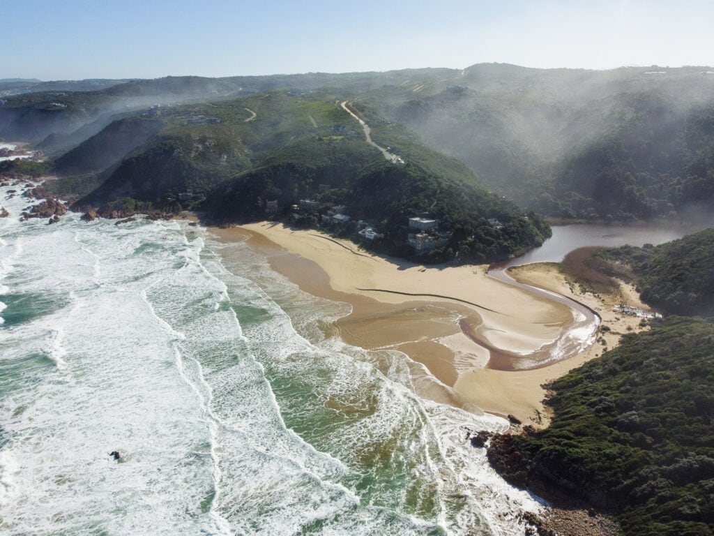 Aerial shot of Noetzie Beach with surrounding beach houses