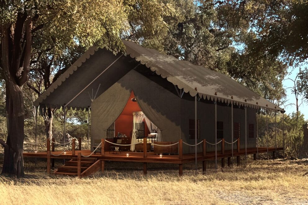 View of concept art for the Mbamba Campsite. The tent is suspended on a small wooden deck in the bush and surrounded by a few large trees.