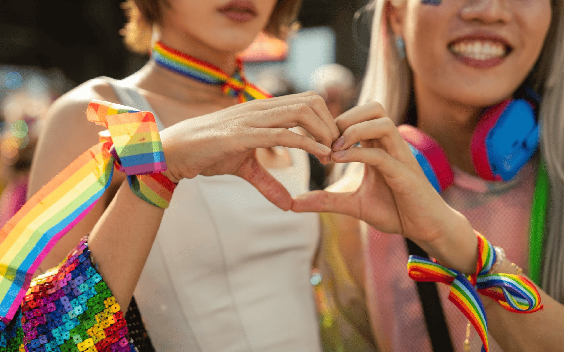 Two queer women at a pride parade