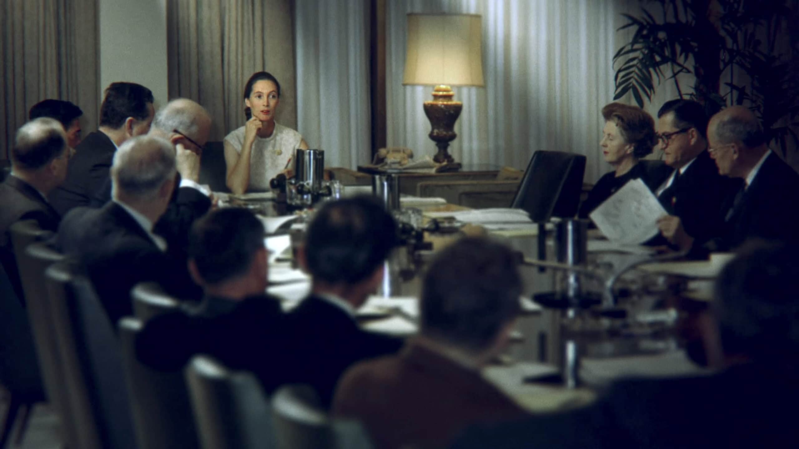 Washington, D.C. - Jane at the head of the table in a meeting